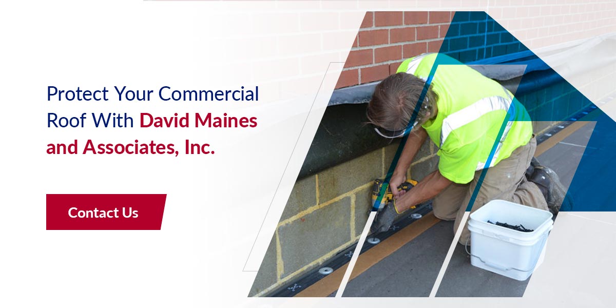 Winter maintenance being performed on a commercial roof